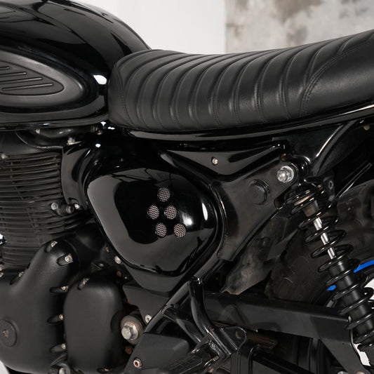 Black custom side covers installed on Royal Enfield Hunter 350 scrambler build with vintage inspired side panels and vented motorcycle styling