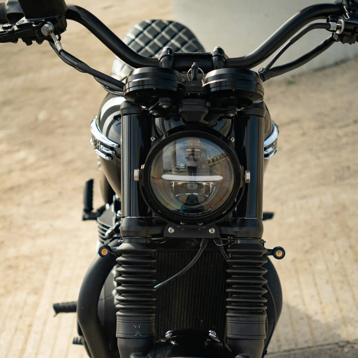 Triumph front cockpit with CNC speedometer case and compact headlight setup