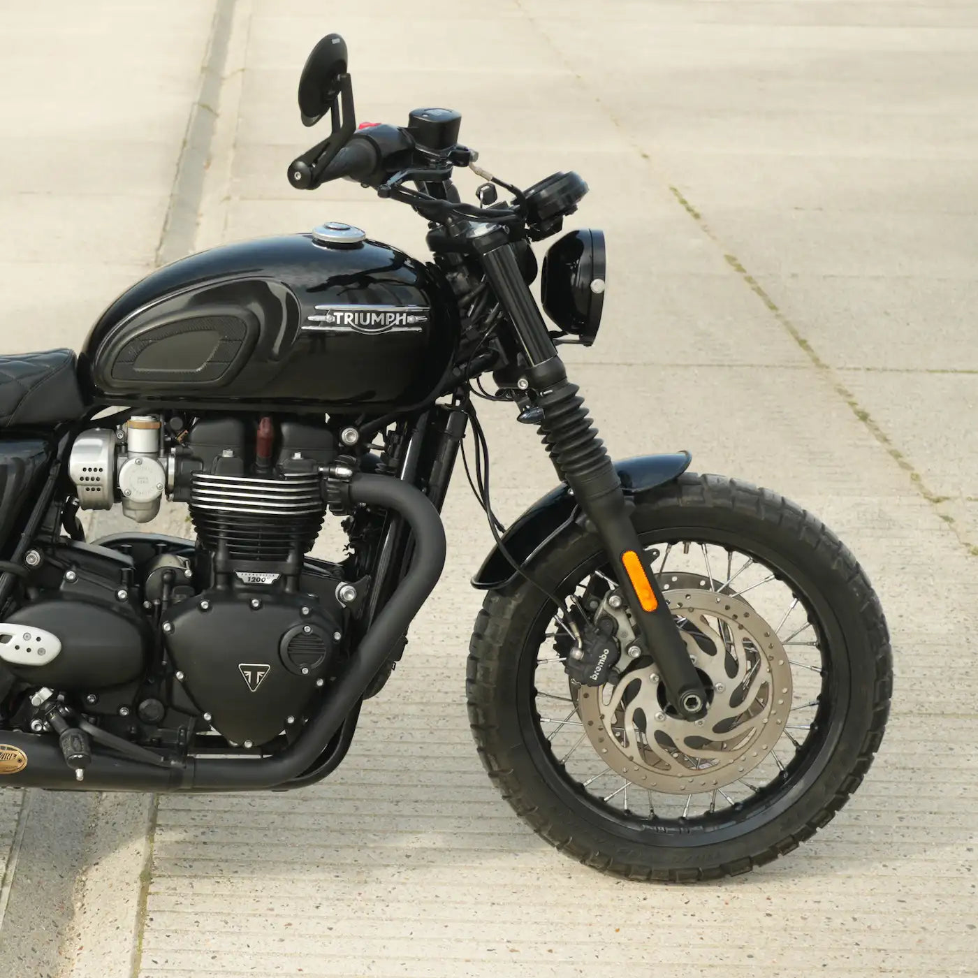 Vintage café racer front mudguard installed on a Triumph Bonneville LC bike