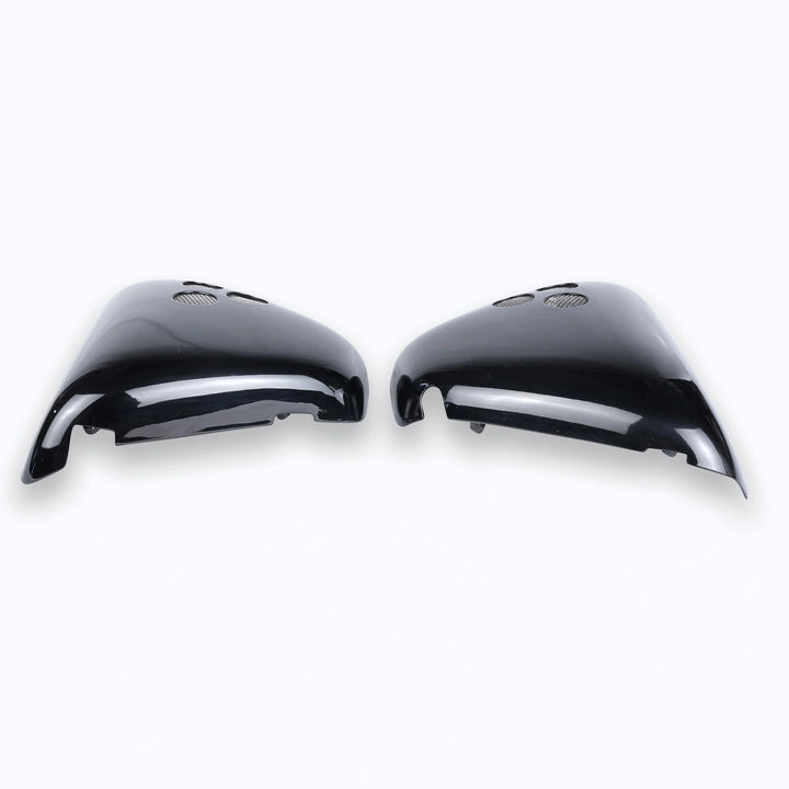 Glossy black Triumph Bonneville T120 side panels on white background