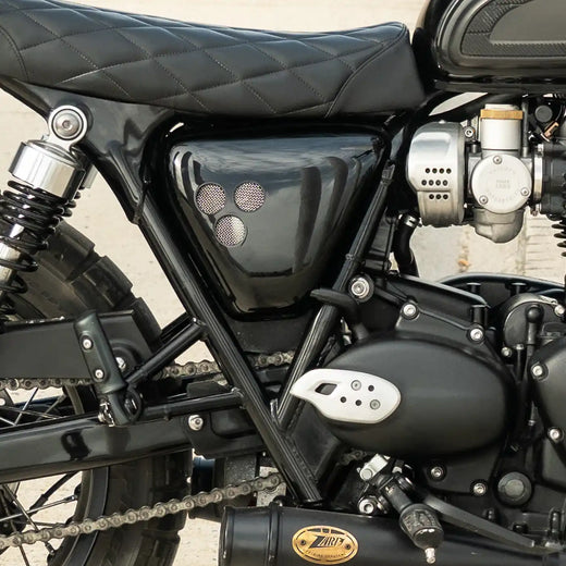 Glossy black side panels installed on a Triumph Bonneville T120