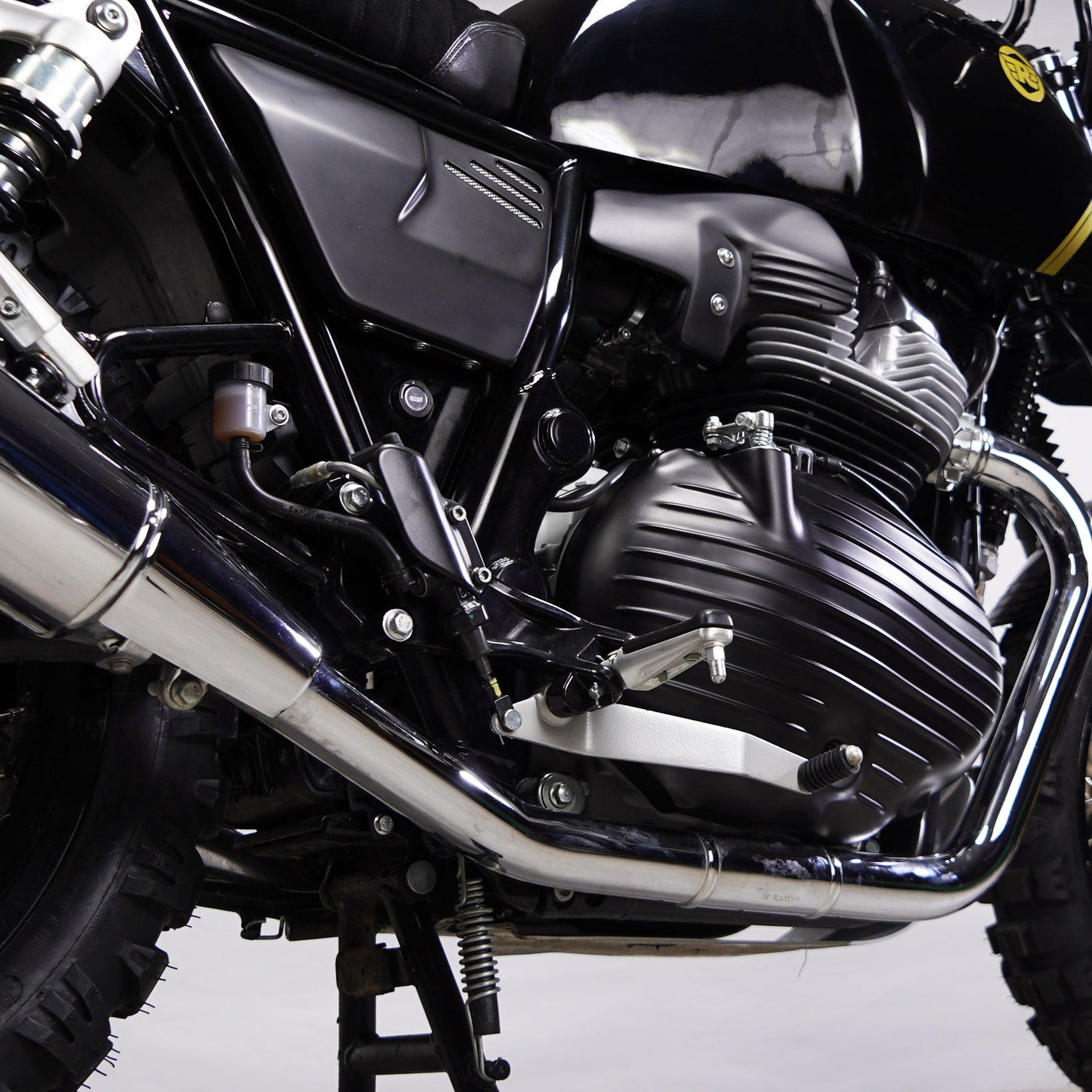Royal Enfield 650 engine area with Bonvent matte black air deflector fitted above the exhaust line