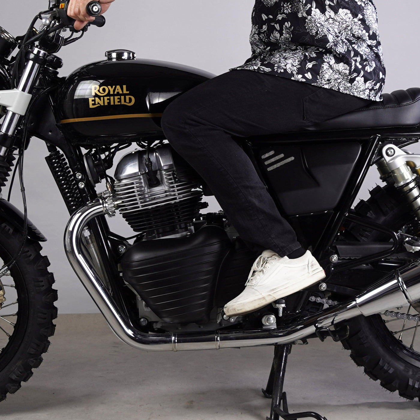 Rider on a Royal Enfield 650 showing the leg position near the Bonvent heat shield air deflector