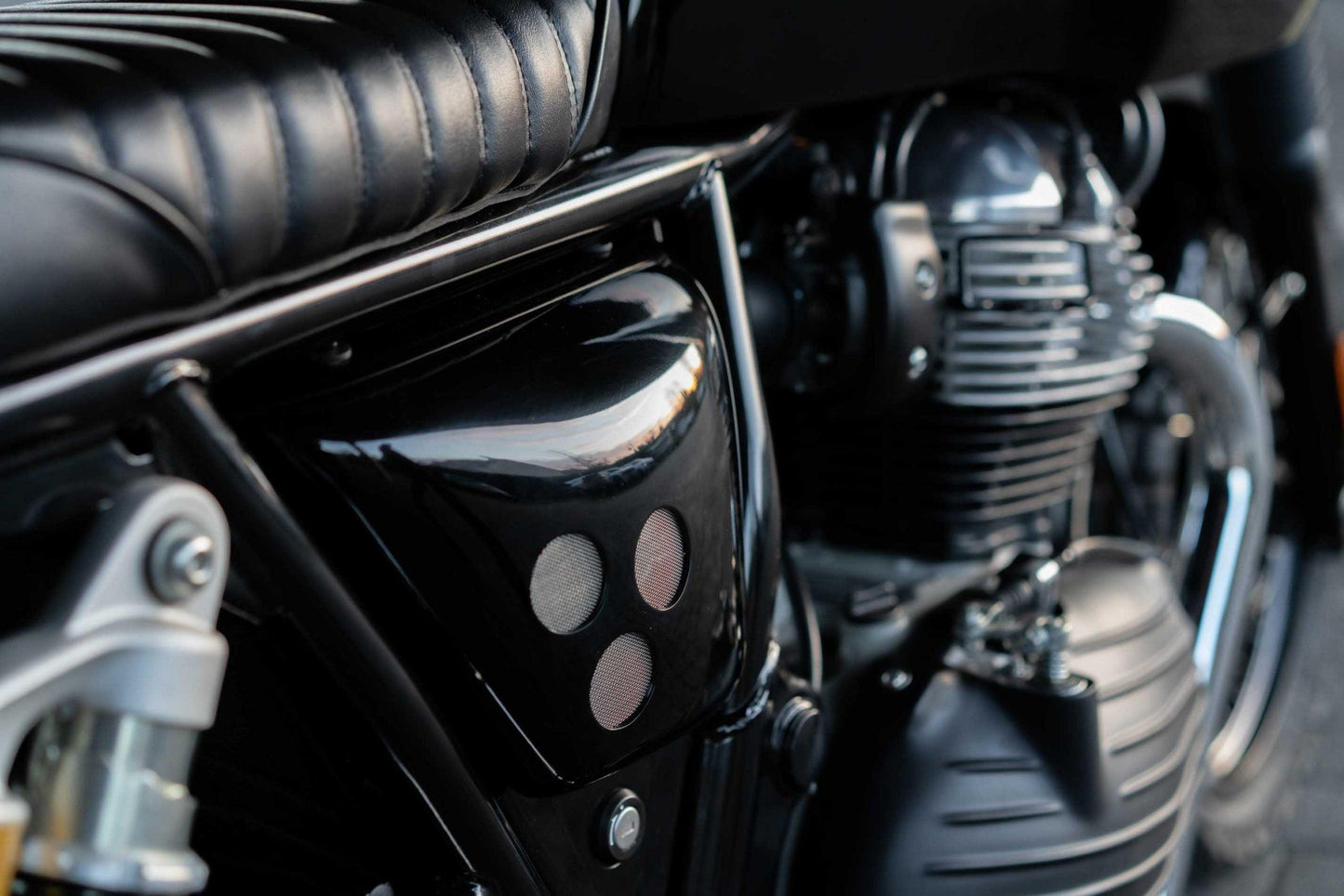 Airflow-enhancing Vintage Side Panels for custom Royal Enfield parts.