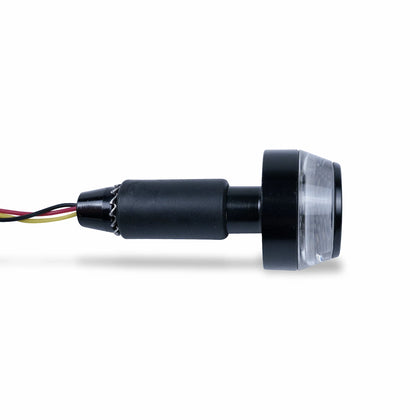 Side view of a black motorcycle bar-end LED indicator with a clear circular lens, expanding mount and three colored wires.