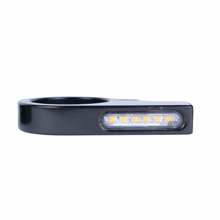 Front view of one black fork-tube motorcycle indicator with a circular mounting opening and a slim clear lens showing six amber LEDs.