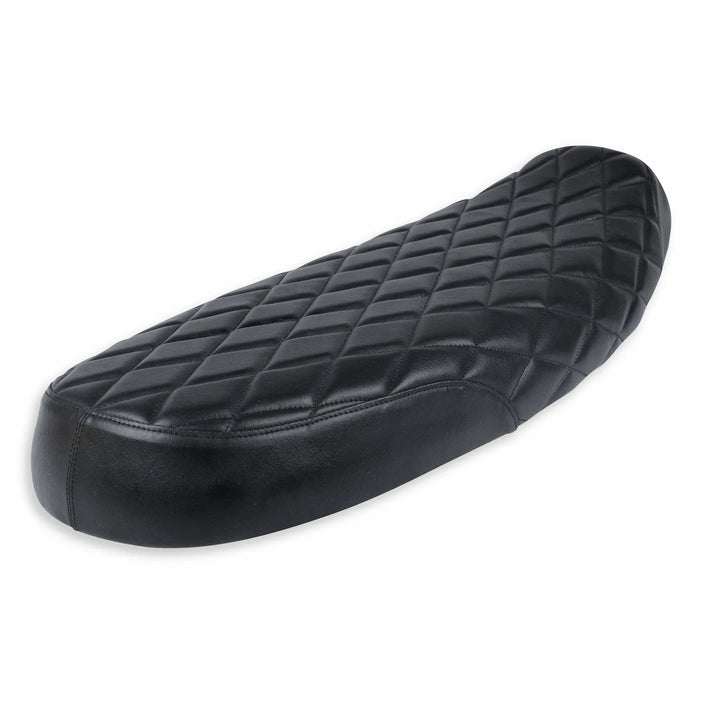 Three-quarter view of a black low-profile motorcycle seat with a raised rear section, smooth side panels and diamond-quilted stitching.