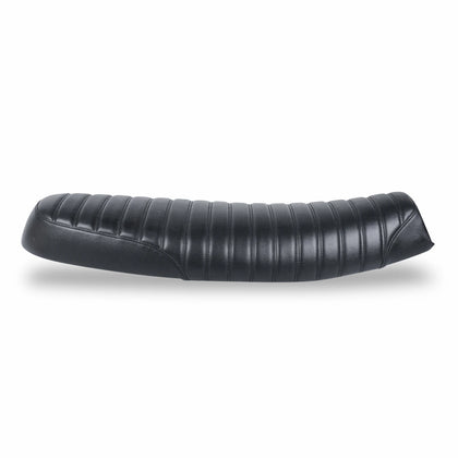 Side view of a low-profile black motorcycle seat with ribbed upholstery, curved stitching and tapered ends on a white background.