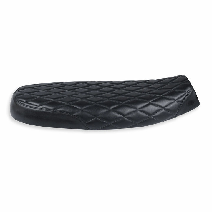 Low-profile black motorcycle seat for Triumph Modern Classics, shown from the side with a raised rear and diamond-quilted synthetic leather cover.