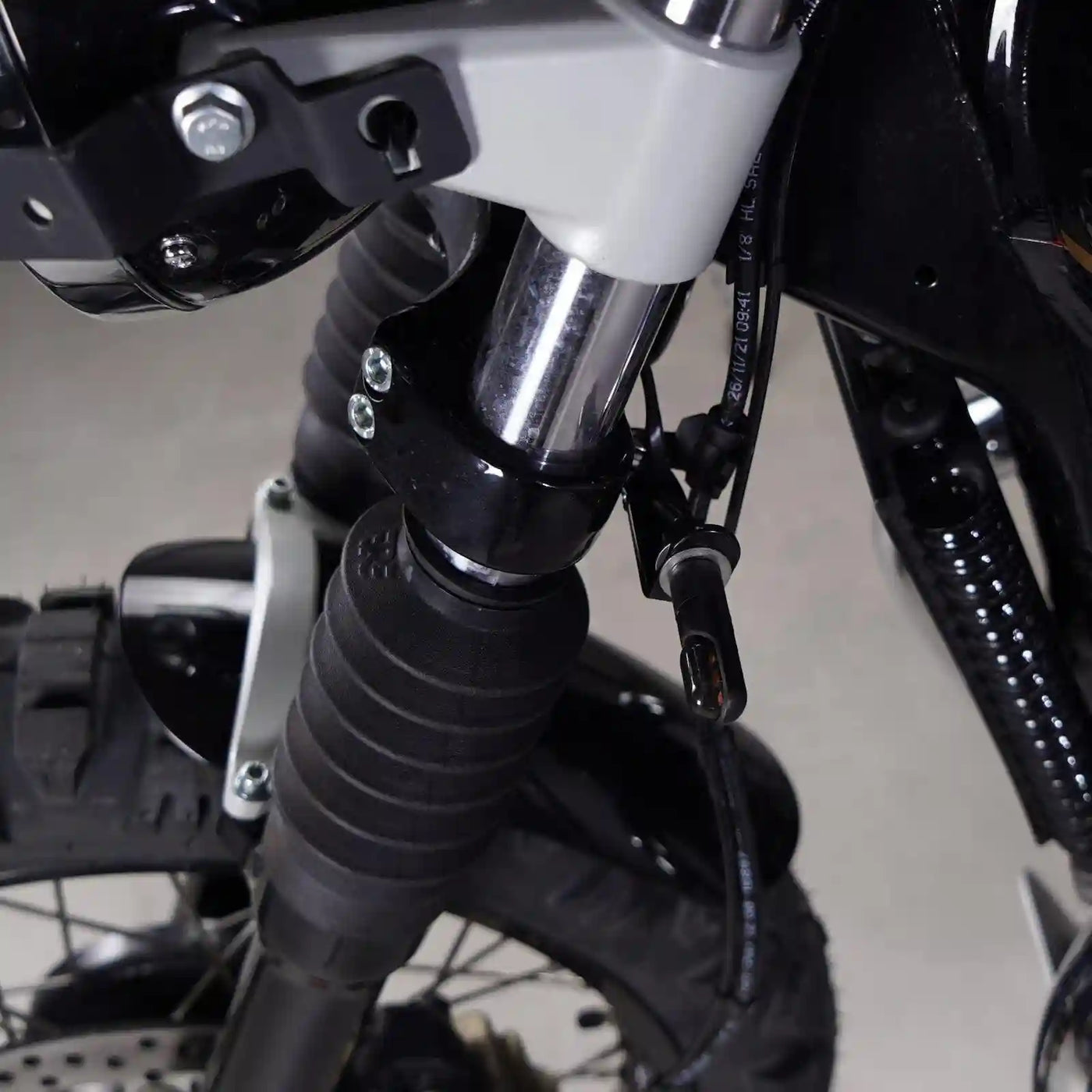 Close up of front indicator bracket installation on Royal Enfield 650