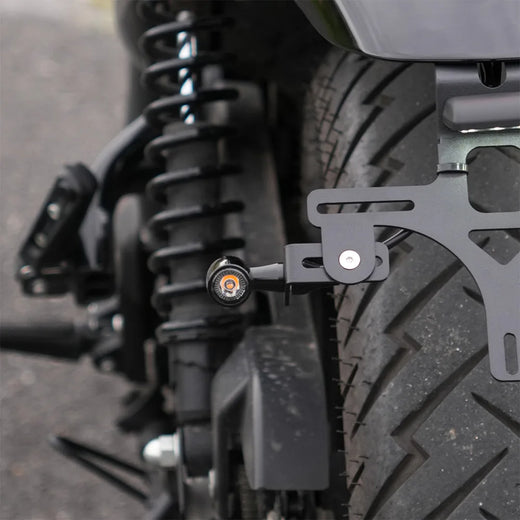 Adjustable rear turn signal brackets for Hunter 350 tail tidy kit, designed to mount rear indicators on the license plate holder.