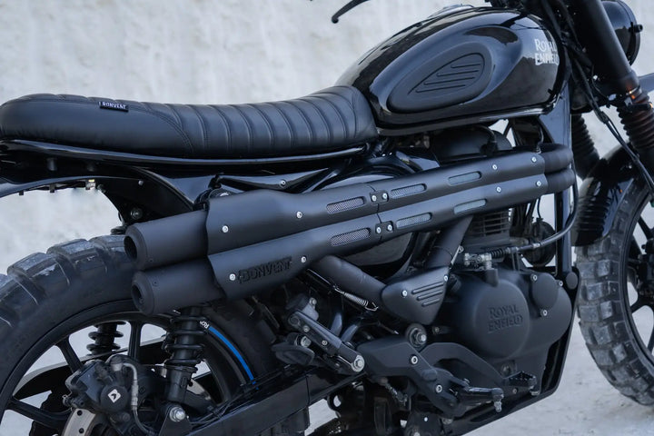 Custom vented side cover and flat seat detail on a Royal Enfield Hunter 350 scrambler