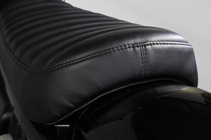 Black ribbed Bonvent solo seat fitted to a Royal Enfield Interceptor 650 scrambler