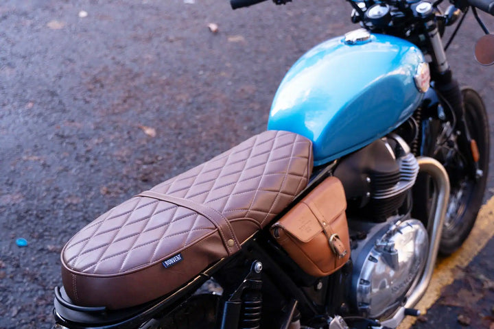 Blue Interceptor 650 fuel tank with tobacco-brown diamond-stitched custom seat