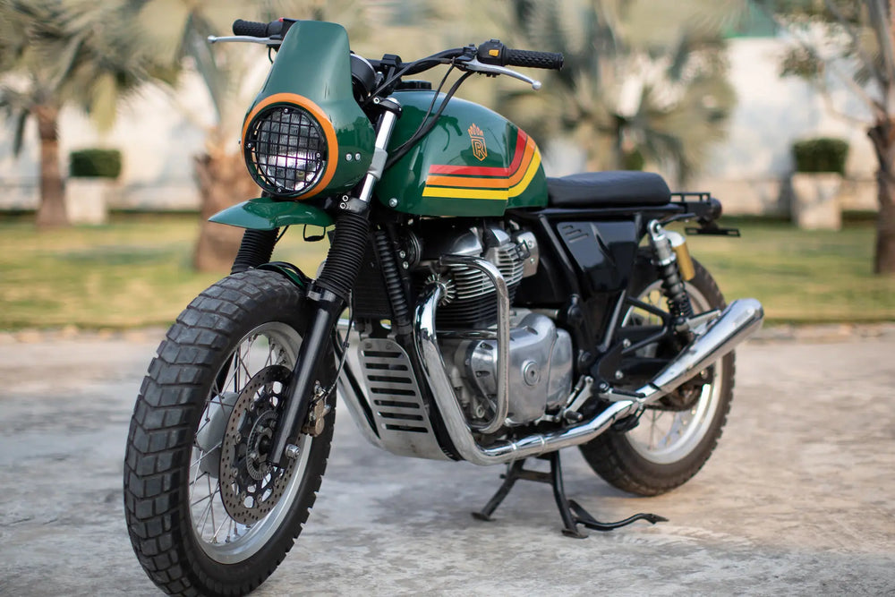 Front three-quarter view of a British Green Royal Enfield Interceptor 650 rally scrambler