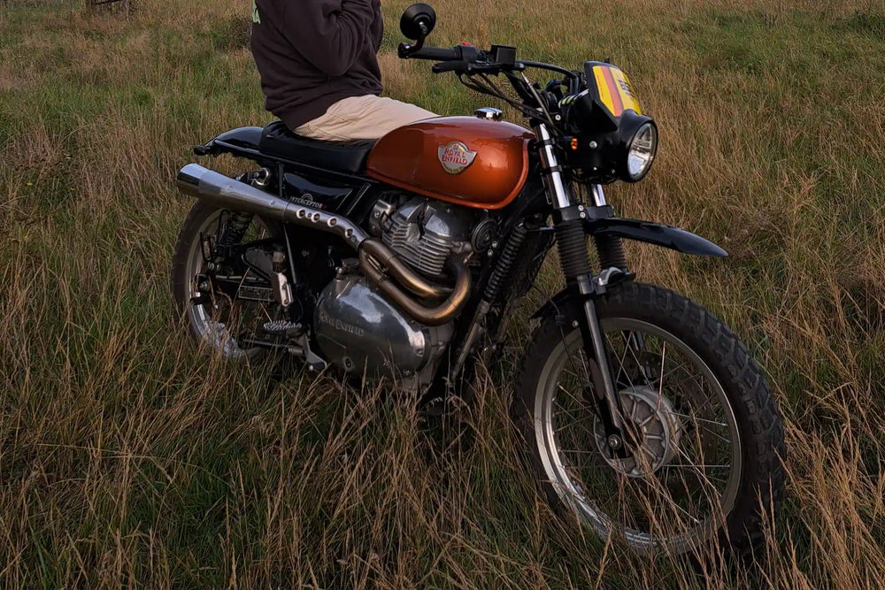 Rear detail of a Royal Enfield Interceptor 650 Orange Crush custom scrambler