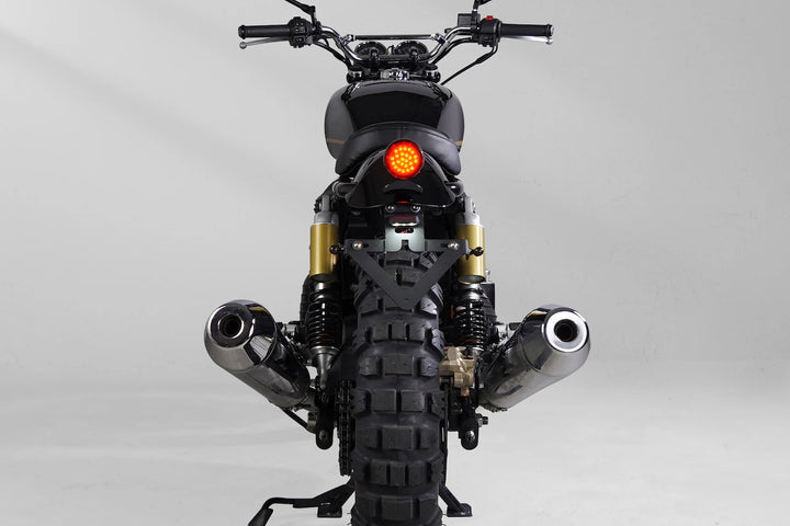 Rear view of an Interceptor 650 scrambler with compact LED tail light and license plate holder
