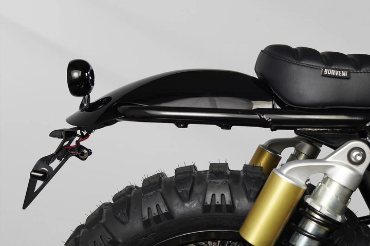 Bonvent ribbed solo seat and raised rear mudguard on a black and gold Interceptor 650 scrambler