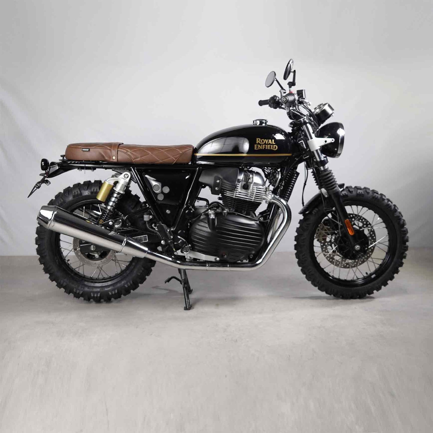 Modular luggage rack and seat kit for scrambler-style motorcycles. Designed for Royal Enfield