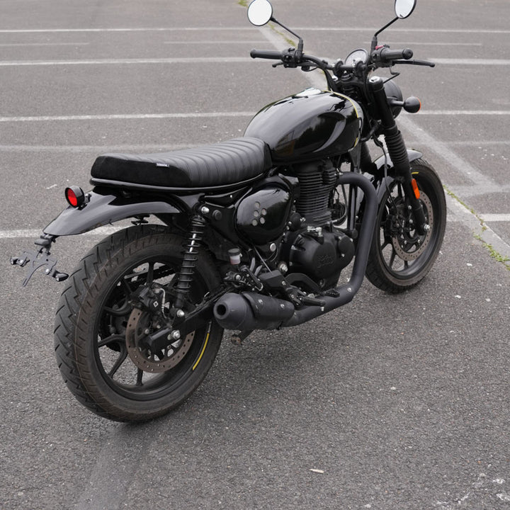Black ribbed suede motorcycle seat installed on Royal Enfield Hunter 350 with custom parts and scrambler accessories