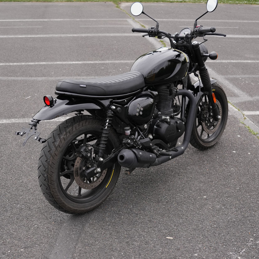 Modern black ribbed seat for Royal Enfield Hunter 350 with custom scrambler and cafe racer motorcycle styling