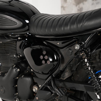 Black custom side covers installed on Royal Enfield Hunter 350 scrambler build with vintage inspired side panels and vented motorcycle styling