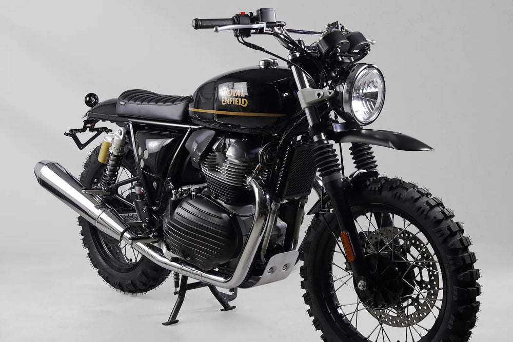 Front three-quarter view of a black and gold Royal Enfield Interceptor 650 scrambler build