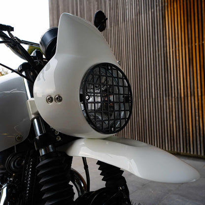 Royal Enfield scrambler headlight cowl with wind protection. Rugged and durable fairing