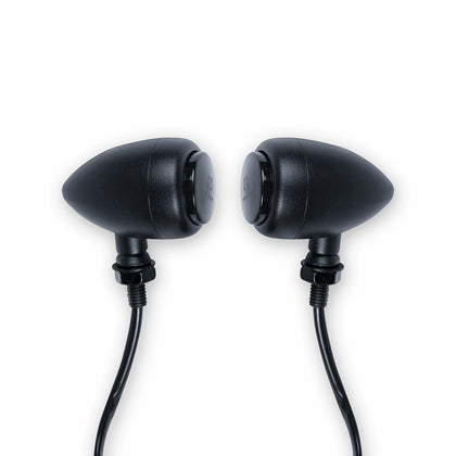 Pair of black bullet-style motorcycle turn signals with smoked lenses, threaded mounting stems, nuts and attached wires.