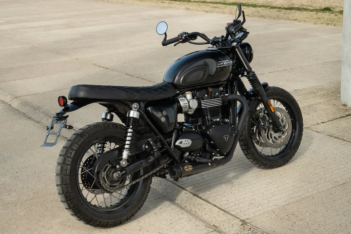 Front three-quarter view of a black Triumph Bonneville T120 custom build with compact Bonvent bodywork