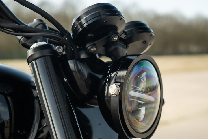 Compact 5.75-inch LED headlight fitted to a black Triumph Bonneville T120 custom build